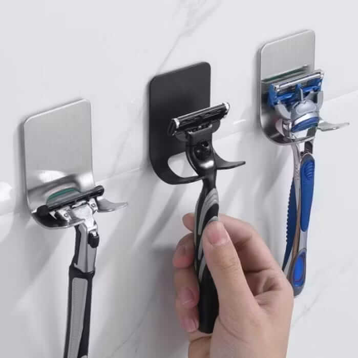 Suporte de aço inox para aparelho de barbear fixado na parede do banheiro com fita adesiva